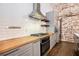 Sleek kitchen with wood counters, subway tile backsplash, and modern appliances at 320 Martin Luther King Jr Se Dr # 9, Atlanta, GA 30312