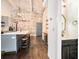 Kitchen with island seating, modern appliances, and a view of the bathroom and staircase at 320 Martin Luther King Jr Se Dr # 9, Atlanta, GA 30312