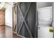 Laundry area with sliding barn door, washer, and dryer at 320 Martin Luther King Jr Se Dr # 9, Atlanta, GA 30312