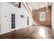 Bright living room featuring exposed brick, high ceilings, and staircase at 320 Martin Luther King Jr Se Dr # 9, Atlanta, GA 30312