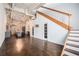 Sunlit living room with hardwood floors, brick wall, high ceilings, and adjacent modern kitchen at 320 Martin Luther King Jr Se Dr # 9, Atlanta, GA 30312
