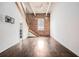 Bright living room boasts hardwood floors, brick wall, high ceilings, and staircase at 320 Martin Luther King Jr Se Dr # 9, Atlanta, GA 30312