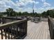 Wooden rooftop deck with chairs and tables offers an outdoor lounging space at 320 Martin Luther King Jr Se Dr # 9, Atlanta, GA 30312