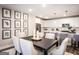 Stylish kitchen with white cabinets, stainless steel appliances, and an island leading to the dining area at 3351 Orwell Way # 2301, Cumming, GA 30041