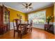 Dining room featuring wood-look flooring, crown molding and a large window for natural lighting at 3770 Wake Robin Way, Cumming, GA 30028