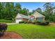 Charming single-Gathering home featuring a well-manicured lawn and a two-car garage at 3770 Wake Robin Way, Cumming, GA 30028