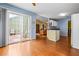 Cozy room featuring wood-look flooring, sliding glass doors to the outdoors, and interior views at 3770 Wake Robin Way, Cumming, GA 30028