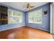 Bright room featuring natural lighting from large windows and wood-look flooring at 3770 Wake Robin Way, Cumming, GA 30028