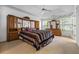 Spacious main bedroom featuring tray ceiling, large windows, and an ensuite bathroom at 3770 Wake Robin Way, Cumming, GA 30028