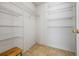 Spacious walk-in closet with ample shelving and neutral flooring at 3770 Wake Robin Way, Cumming, GA 30028