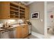Stylish bar area with custom cabinets, stainless steel appliances, and elegant finishes at 92 Old Ivy Ne Rd # 6, Atlanta, GA 30342