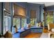 Dining area features a built-in window seat with custom drapery and abundant natural light at 92 Old Ivy Ne Rd # 6, Atlanta, GA 30342