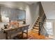 Inviting entryway with rustic console table, decorative mirror, and staircase with runner at 92 Old Ivy Ne Rd # 6, Atlanta, GA 30342