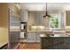 Bright kitchen featuring stainless steel appliances, white cabinetry, and a view from the window at 92 Old Ivy Ne Rd # 6, Atlanta, GA 30342