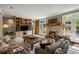 Cozy living room with stone fireplace, built-in shelving, and French doors to the patio at 92 Old Ivy Ne Rd # 6, Atlanta, GA 30342