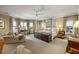 Spacious main bedroom with a canopy bed, sitting area, and bay windows offering natural light and views at 92 Old Ivy Ne Rd # 6, Atlanta, GA 30342