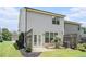 Exterior of the house featuring a backyard with grass, a patio, and landscaping at 252 Stone Park Dr, Woodstock, GA 30188