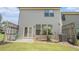 Backyard with a patio, grass, and a view of the house's exterior at 252 Stone Park Dr, Woodstock, GA 30188