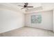 Spacious bedroom with trey ceiling, ceiling fan, and a large window at 252 Stone Park Dr, Woodstock, GA 30188