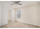 Bedroom with ceiling fan, closet, and window overlooking backyard at 252 Stone Park Dr, Woodstock, GA 30188