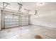 Spacious two-car garage with white doors and a concrete floor at 252 Stone Park Dr, Woodstock, GA 30188