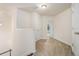 Hallway with neutral carpet and access to multiple rooms at 252 Stone Park Dr, Woodstock, GA 30188