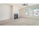 Large living room featuring a fireplace, neutral carpet and bright light at 252 Stone Park Dr, Woodstock, GA 30188