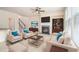 Bright, staged living room with fireplace, plush seating, and built-in bookcase at 252 Stone Park Dr, Woodstock, GA 30188