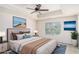 Staged main bedroom with a king bed, neutral colors, tray ceiling and stylish decor at 252 Stone Park Dr, Woodstock, GA 30188