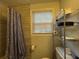 Bathroom with storage shelves, neutral tile walls, and plenty of natural light at 2620 Northview Ave, Decatur, GA 30032
