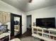 Well-lit bedroom with a large mirror, white furniture, and a patterned rug at 2620 Northview Ave, Decatur, GA 30032