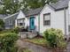 Charming home featuring a newly painted exterior and a delightful blue front door at 2620 Northview Ave, Decatur, GA 30032