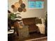 Stylish living room with a vintage sofa, decorative wall hangings, and indoor plants at 2620 Northview Ave, Decatur, GA 30032