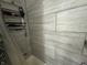 Modern shower featuring sleek tile and a convenient storage rack for toiletries at 2620 Northview Ave, Decatur, GA 30032