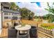Back deck featuring outdoor seating, a wood railing, and a view of a golf course at 2641 Camphor Se Xing # 82, Smyrna, GA 30080