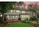 Backyard featuring a patio area with seating, a lush lawn, and well-manicured landscaping for outdoor enjoyment at 2965 Village Dr, Marietta, GA 30062