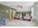 Comfortable bedroom with two twin beds, a ceiling fan, and a walk-in closet providing ample storage at 2965 Village Dr, Marietta, GA 30062