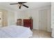 Bedroom with a rocking chair, dresser, neutral walls, and bright window at 2965 Village Dr, Marietta, GA 30062