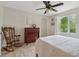 Bedroom featuring a rocking chair, dresser, soft natural light, and a restful atmosphere at 2965 Village Dr, Marietta, GA 30062