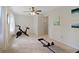 Spacious bedroom with exercise equipment and a neutral palette provides a versatile living space at 2965 Village Dr, Marietta, GA 30062