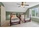 Charming bedroom with twin beds, natural light, a ceiling fan, and an adjacent closet at 2965 Village Dr, Marietta, GA 30062