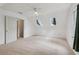 A bright bonus room features two skylights, a window, plush carpeting, and neutral walls at 2965 Village Dr, Marietta, GA 30062
