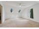A light-filled bonus room features two skylights, a window with plush carpeting, and neutral walls at 2965 Village Dr, Marietta, GA 30062