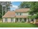Charming two-story home featuring a well-manicured lawn and inviting curb appeal at 2965 Village Dr, Marietta, GA 30062