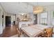 Eat-in kitchen featuring white cabinets, granite countertops, and stainless steel appliances at 2965 Village Dr, Marietta, GA 30062