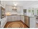 Well-equipped kitchen with white cabinets, granite countertops, and stainless steel appliances at 2965 Village Dr, Marietta, GA 30062