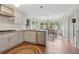 Bright eat-in kitchen with stainless steel appliances, white cabinets, and tile floors at 2965 Village Dr, Marietta, GA 30062