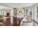 Open living room with hardwood floors, fireplace, large windows, and stylish decor at 2965 Village Dr, Marietta, GA 30062