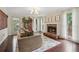 Spacious living room with fireplace, hardwood floors, natural light, and comfortable seating at 2965 Village Dr, Marietta, GA 30062