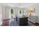 Bright office with dark hardwood floors, chandelier, and a scenic view of the outdoors at 2965 Village Dr, Marietta, GA 30062